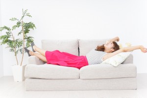 Young woman sleeping on the sofa